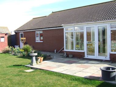 Rear garden with conservatory and patio